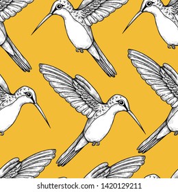 
Cute  hummingbirds. Seamless pattern with flying birds. Vintage texture with engraved elements on a yellow background.