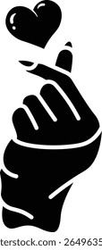 Cute illustration of a hand forming a Korean finger heart gesture icon vector solid style. A small heart floats above it.