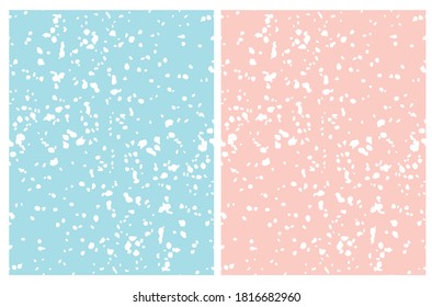 Cute Irregular Geometric Seamless Vector Patterns. White Hand Drawn Spots on a Light Blue and Pastel Pink Background. Winter Snowy Sky Print.