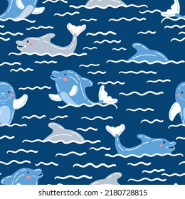 Cute joyful childish dolphin vector seamless pattern. Pretty sea mammal endless fill design. Hand drawn cartoon dolphin play in the sea. Kids seamless pattern. Happy cubs on dark blue background.