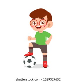 cute kid boy play soccer as striker