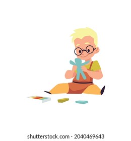 Cute kid boy sit on floor and making human figure from blue plasticine. Little child sculpt crafts in kindergarten, school or creativity class. Flat cartoon vector illustration.