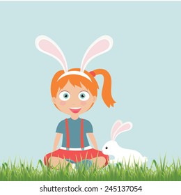 Cute kid with easter bunny and decorated eggs.