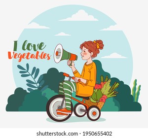 Cute kid with fresh vegetables rides on bicycle in the garden. Funny girl shouting on the megaphone. Summer time