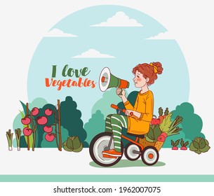 Cute kid with fresh vegetables rides on bicycle in the garden. Funny girl shouting on the megaphone. Summer time