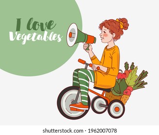 Cute kid with fresh vegetables rides on bicycle in the garden. Funny girl shouting on the megaphone. Summer time