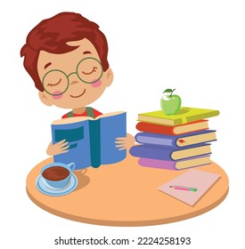 un chico lindo leyendo un libro en la mesa redonda