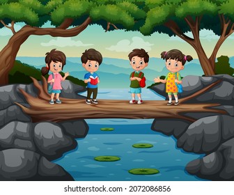 Cute kids cross the river on the tree trunk bridge