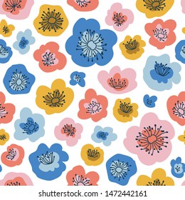 Cute kids floral pattern with colorful flowers on the white background. Funny hand-drawn seamless design for fabric, wrapping or wallpaper.