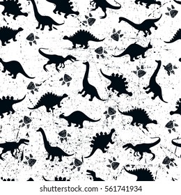 Cute kids pattern for girls and boys. Colorful dinosaurs on the abstract grunge background create a fun cartoon drawing. The background is executed in monochrome colors. For textile and fabric  