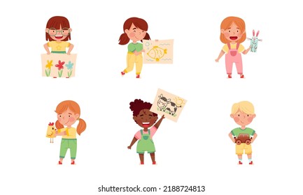 Cute kids showing their DIY crafts set. Boys and girl holding drawings and paper crafts cartoon vector illustration