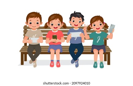 cute kids sitting on bench using smartphone and digital tablet playing game, browsing internet, chat and taking selfie with mobile phone