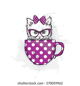 Cute kitten in a cup. Vector illustration.