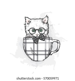 Cute kitten in a cup. Vector illustration.