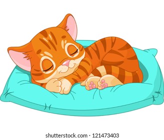 Cute kitten sleeping on the blue pillow