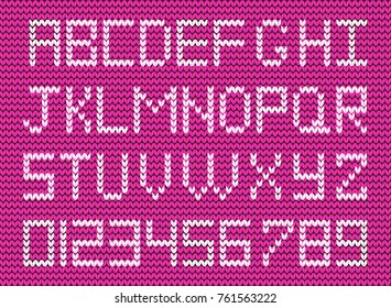 Cute knitted abc alphabet, knitting pattern on purple fabric background. White fabric script. Useful for cards, invitations, design, text creation. 