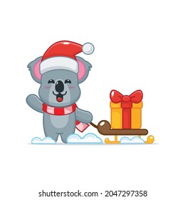 Cute koala in christmas day carrying gift box. Cute christmas cartoon illustration