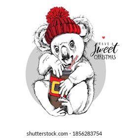Cute Koala in the knitted hat and with a plastic cup of coffee. Merry Christmas and New year card, Humor composition, hand drawn style print. Vector illustration.