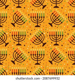 Cute Kwanzaa seamless pattern with seven kinara candles and dots, stars, in traditional African colors - black, red, green on yellow. Vector Kwanzaa holiday background design.