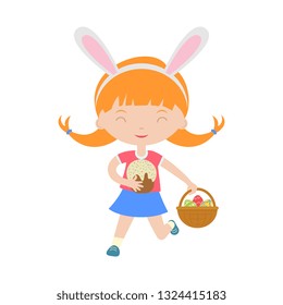 Cute laughing running girl with bunny ears holding basket with eggs.Child hunting for easter eggs