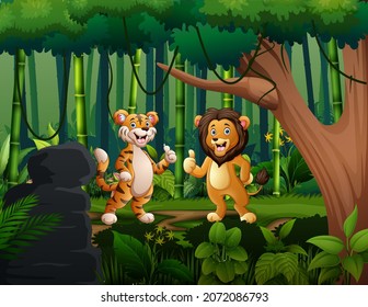 Cute lion and tiger giving thumb up at the jungle