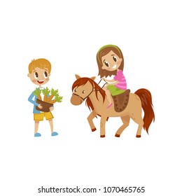 Cute litlle girl riding a horse, boy standing next to the horse with basket of carrots, equestrian sport concept cartoon vector Illustration isolated on a white background