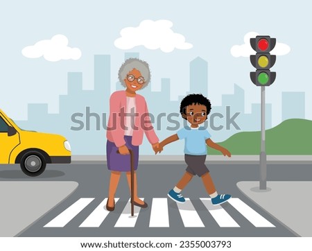 Cute little African boy help elderly grandmother crossing street at the pedestrian traffic