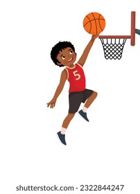 Cute little African boy jumping scoring a layup at basketball game