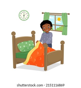 cute little African boy making bed arranging pillow and bed cover neat doing her housework chores in the morning at home