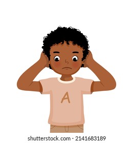 Cute little African boy  not listening plugging and covering his ears with fingers from noisy loud sound showing annoyed facial expression