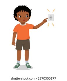 Cute little African boy play with electricity put his finger into electric socket