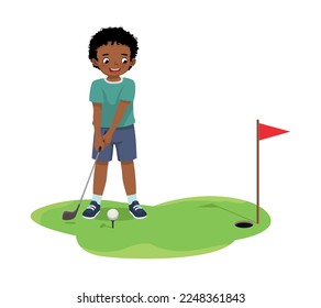 Cute little African boy playing golf ready to hit ball aiming at the hole