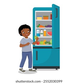 Cute little African boy taking apple out of refrigerator