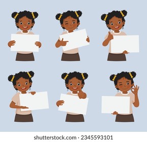 Cute little African girl holding blank poster in various facial expressions and hand gestures, include like, thumb up, finger pointing