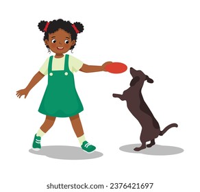 Cute little African girl playing with her pet dog