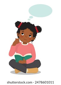 Cute little African girl thinking dreaming while reading book sitting on floor