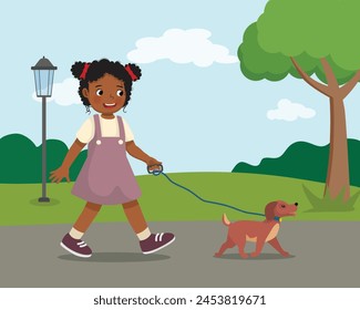 Cute little African girl walking the dog at the park