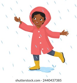 Cute little African girl wears raincoat playing in the rain