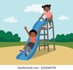 Cute little African kids boy and girl having fun on slide in playground at the park