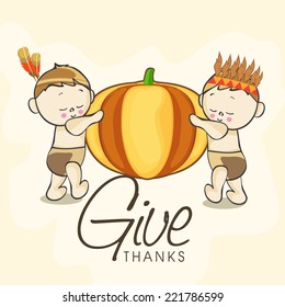 Cute little American and Indian kids holding big pumpkin on grungy beige background for Happy Thanksgiving Day celebrations.