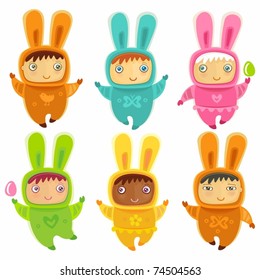 A cute little babies dressed as an Easter Bunnies with Easter eggs
