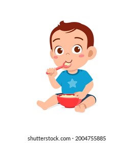 Cute Little Baby Boy Eat Porridge In Bowl With Spoon