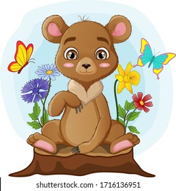 Cute little bear sitting on tree stump