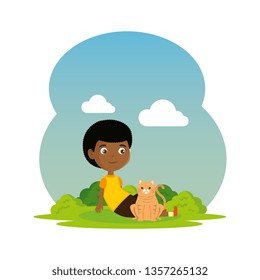 cute little black boy with kitty in the landscape