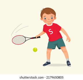 cute little boy athlete play tennis at sport club holding tennis racket ready to hit the ball