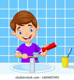 Cute little boy brushing teeth in bathroom