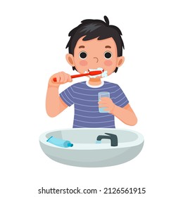 lindo niño cepillado dientes con pasta dental sujetando un vaso de agua para limpiar la actividad diaria de higiene de rutina