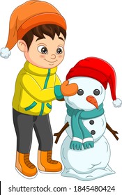 Cute little boy building a snowman