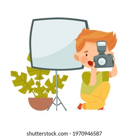 Cute Little Boy with Camera Taking Photograph Having Studio Lighting Vector Illustration