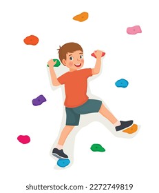 Cute little boy climbing wall with colorful rock